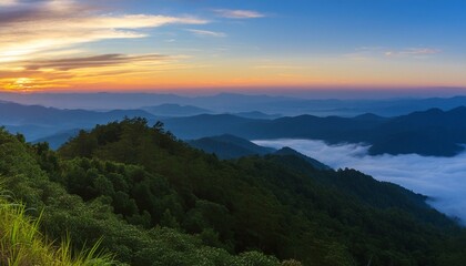 green mountain with fog and sunrise twilight sky at background