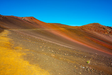 Haleakala Volcano sunrise mountain over blue sky background at Maui Hawaii USA.