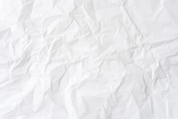 Wrinkled or crumpled white stencil paper or tissue after use in toilet or restroom with large copy...