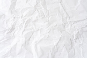Wrinkled or crumpled white stencil paper or tissue after use in toilet or restroom with large copy space used for background texture in decorative art work