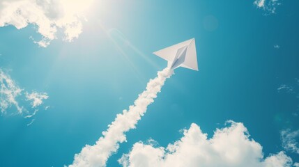 Bold white paper arrow soaring across a blue sky background, metaphor for achieving business goals and career milestones