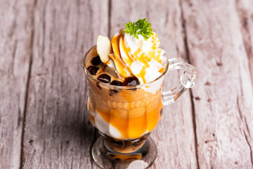 Tea ice cream in glass cup.Collection of different desserts.Gourmet summer dessert of artisanal or craft ice cream made.Cafe menu.