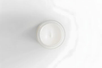 minimalist image of an open jar of moisturizing cream, captured from above cream's rich texture and pure white color are emphasized against clean white background symbolizing purity skincare luxury