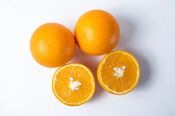Ripe oranges isolated on a white background, top view.