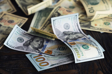 Money, US dollar bills background. Money scattered on the desk. Photography for Finance and Economy concepts.