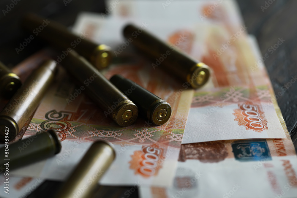 Wall mural Bullets lie on the russians money money with inscription five thousands rubles top view