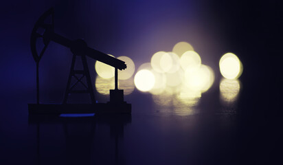 In the evening, the silhouette of oilfield derrick. Beam pumping unit under the night, closeup of...
