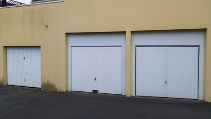 facade of building house triple garage door in closed sectionable pvc curtain