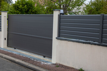 dark gray aluminum gate portal of suburb grey house door entry
