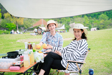 Women Friends Enjoying Outdoor Camping Picnic