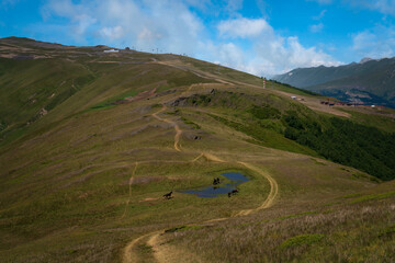 View from the tourist trail to Smirnov Peak to the upper station of the chairlift of the Arkhyz ski...