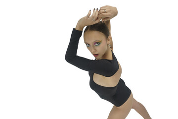 young female dancer in a bodysuit shows elements of choreography with her hands above her head top...