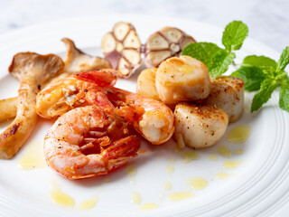 Grilled shrimp and scallops on a plate