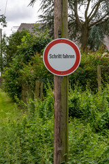 There is a sign on a post in a field that says &ldquo;Step Drive.&rdquo;