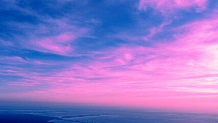 Naklejka premium Colorful cloudy sky at sunset. Gradient color. Sky texture. Abstract nature background