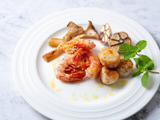 Grilled shrimp and scallops on a plate