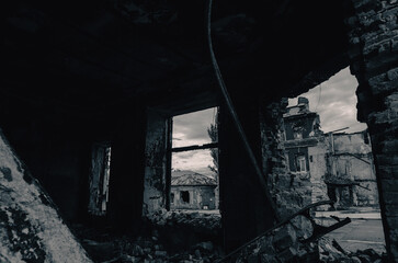 destroyed and burned houses in the city during the war in Ukraine