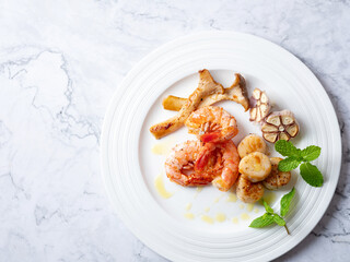 Grilled shrimp and scallops on a plate