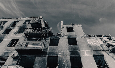 destroyed and burned houses in the city during the war in Ukraine