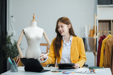 Fashion designers at work. beautiful young woman working in fashion design studio.