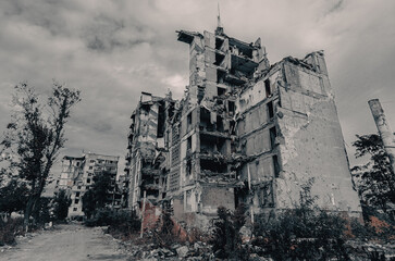 destroyed and burned houses in the city during the war in Ukraine