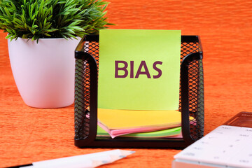 Personal opinions prejudice bias. Concept Bias on a sticker on a stand near a calculator, pencils...