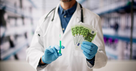 Doctor With Money Holding Syringe. Medical Vaccination Fraud