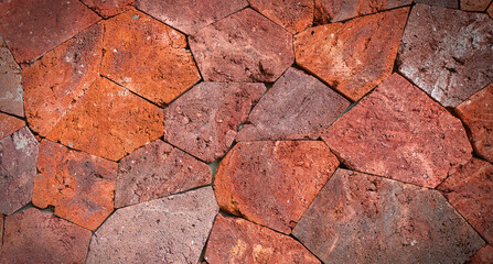 Background of red uneven large stones