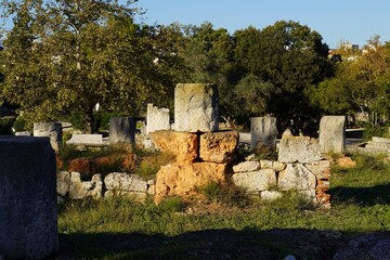 Old stone column and wall fragments in the Ancient Agora or marketplace of Athens