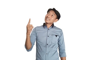 A portrait of an Asian man wearing a ligh blue shirt, pointing in a certain direction with both hands, isolated on a white background.