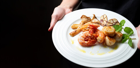 Grilled shrimp and scallops on a plate	