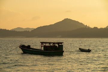 fishing boat silhouette at sunset