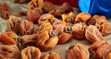 Dried persimmons on a wooden board