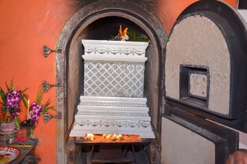 Thai religious rituals for cremation A corpse in a coffin is cremated in a crematorium or...
