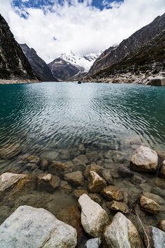 panormaic view of laguna paron in the snow-covered andes in the Huascar&aacute;n national park in peru