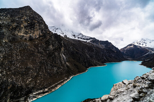 panormaic view of laguna paron in the snow-covered andes in the Huascar&aacute;n national park in peru