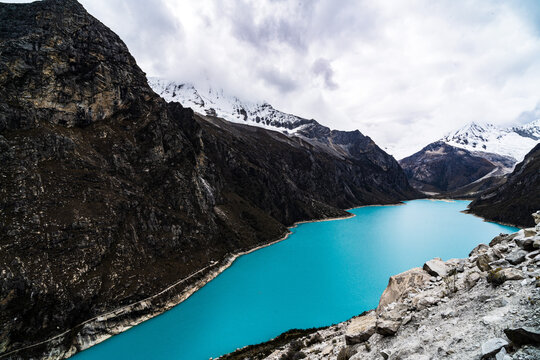 panormaic view of laguna paron in the snow-covered andes in the Huascar&aacute;n national park in peru