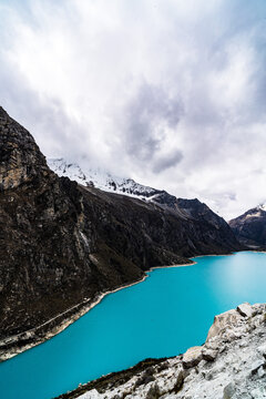 panormaic view of laguna paron in the snow-covered andes in the Huascar&aacute;n national park in peru