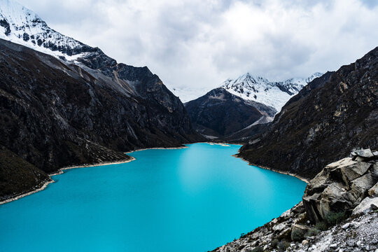 panormaic view of laguna paron in the snow-covered andes in the Huascar&aacute;n national park in peru