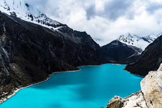 panormaic view of laguna paron in the snow-covered andes in the Huascar&aacute;n national park in peru
