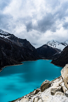 panormaic view of laguna paron in the snow-covered andes in the Huascar&aacute;n national park in peru