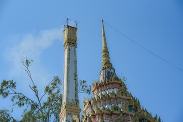 Fototapeta premium Smoke from the cremation chimney according to Thai Buddhist tradition Smoke on a crematorium from cremation or cremation of a deceased person.
