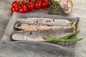 Marinated herring fillet with green onion