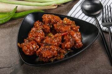 Manchurian chicken with sauce and spices