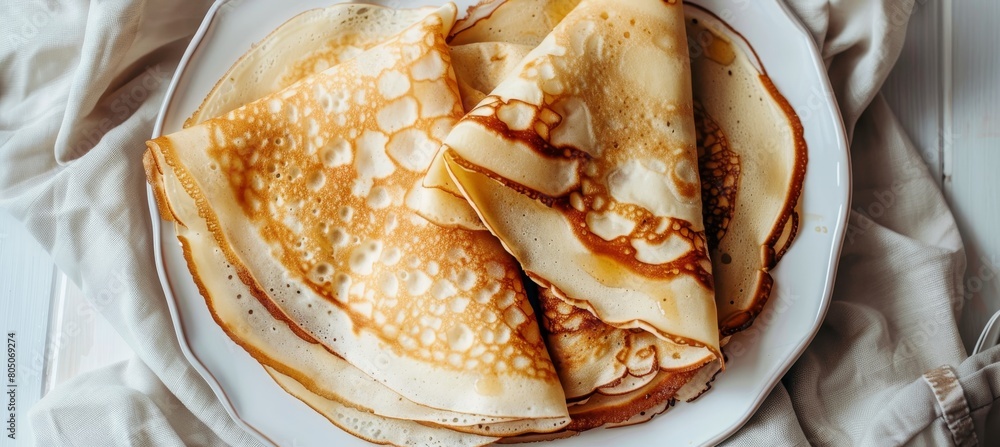 Poster top view of rolled pancakes on light background with ample space for text placement