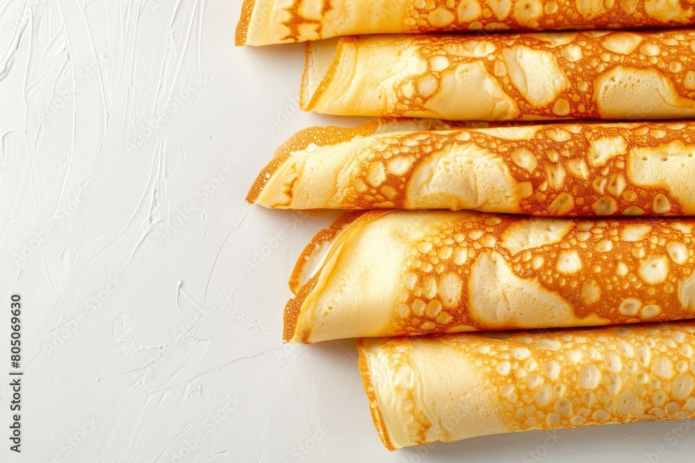Poster top view of rolled pancakes on light or gray background with ample space for text placement