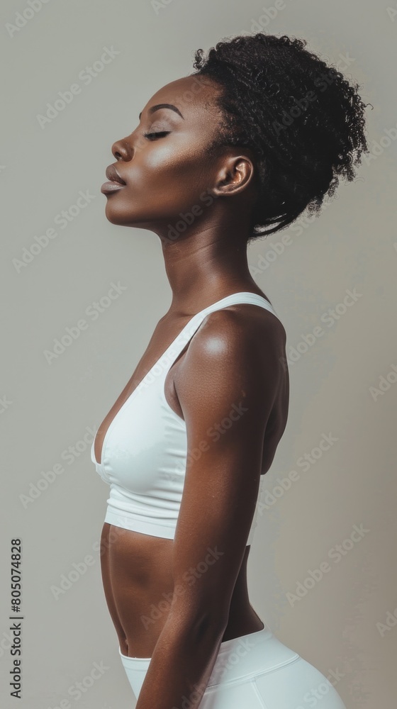 Canvas Prints A woman is wearing a white tank top and white pants