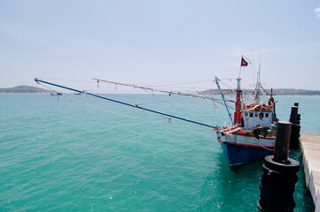 Obraz premium Traditional fishing boat for crab catching moored at wharf in Phuket, Thailand.