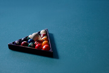 Billiard balls in the triangle on the snooker table.