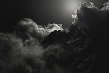 Dramatic black and white photo capturing towering mountain peaks enveloped by swirling, ethereal clouds, emphasizing a sense of majestic isolation and natural grandeur.

